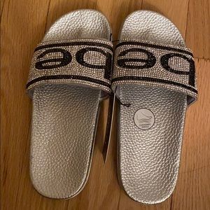Girls BEBE slides. Brand new never worn.